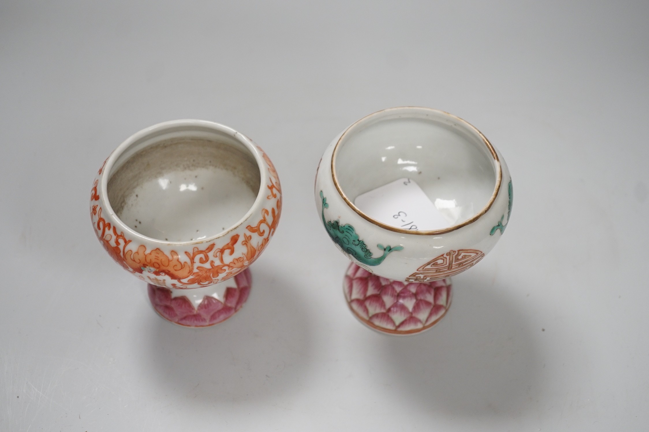 Two 19th century Chinese enamelled porcelain stem bowls, each painted with bats and Shou, the foot with Lotus petals, tallest 11cm